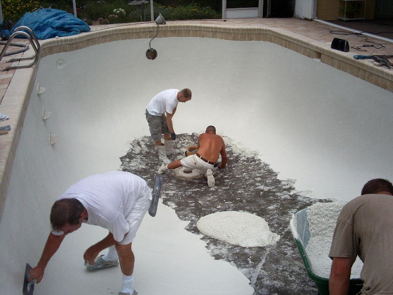 New tile on pool, finish being applied over fresh bond-coat